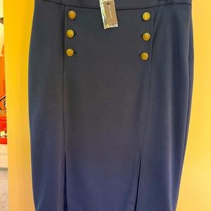 New navy blue, high waisted skirt with dual pleats and brass buttons. Size 12.